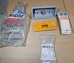 Mopar Nos 3403765 & 3403834 1970 Body Side Marker Housing And Amber Lens. Fixed Price $165.00.