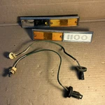 1969 1970 International 1100 Side Marker Light Trim /nameplate W/ Pigtails. Fixed Price $125.00.