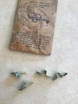 Nos 1953-55 Corvette Headlight Retaining Clips (4) Gm 5947710. Fixed Price $38.00.