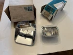 Nos 1978-81 Camaro Parking Lamp Bezel And Signal GM#459154 913641. Fixed Price $120.00.